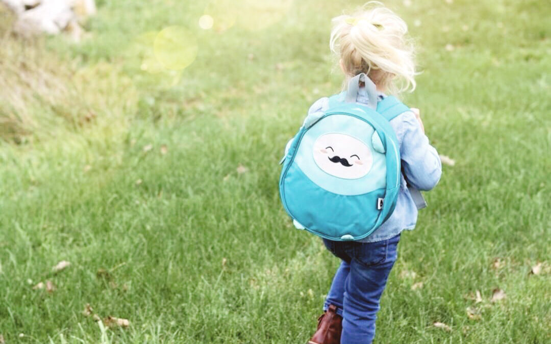 little girl with blue kawaii backpack